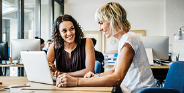 2 women at a laptop